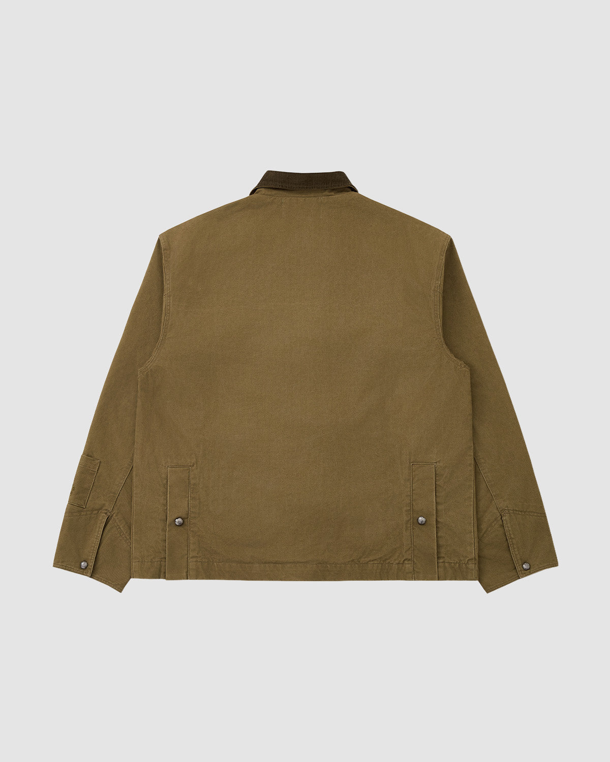 The TAN KNOT BARN JACKET by Sundae School is displayed flat on a white background, showing its back with a corduroy collar, long sleeves, buttoned side tabs, and clean hem—a modern heritage piece in khaki brown.