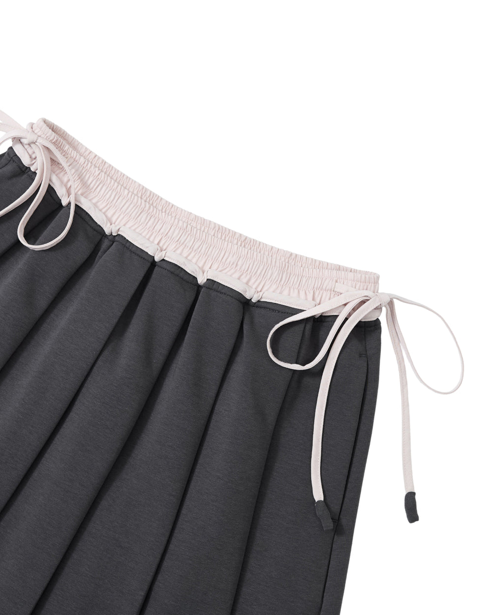 Detail of the white drawstring waistband and pleats on the Sundae School CHARCOAL KONA MIDI SKIRT.