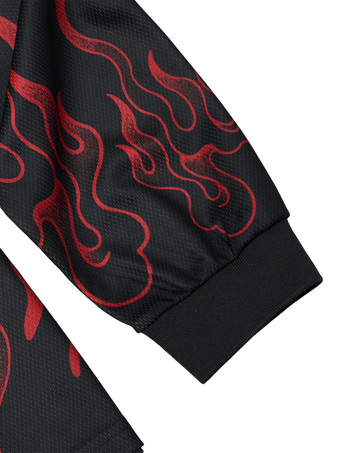Close-up of the KOREATOWN FOOTBALL JERSEY by Sundae School, showcasing a black sleeve adorned with red flame patterns and finished with a ribbed black cuff. The textured fabric highlights the bold spirit of K-Town fashion, drawing inspiration from traditional Korean folk tiger jacket motifs.