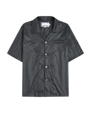 The MAEHWA EMBROIDERED SHEER SHIRT by Sundae School is a short-sleeve, dark gray, collared button-up featuring a crinkled texture and distinctive flower-shaped black buttons down the front—this unisex going-out shirt effortlessly elevates any look with its unique edge.