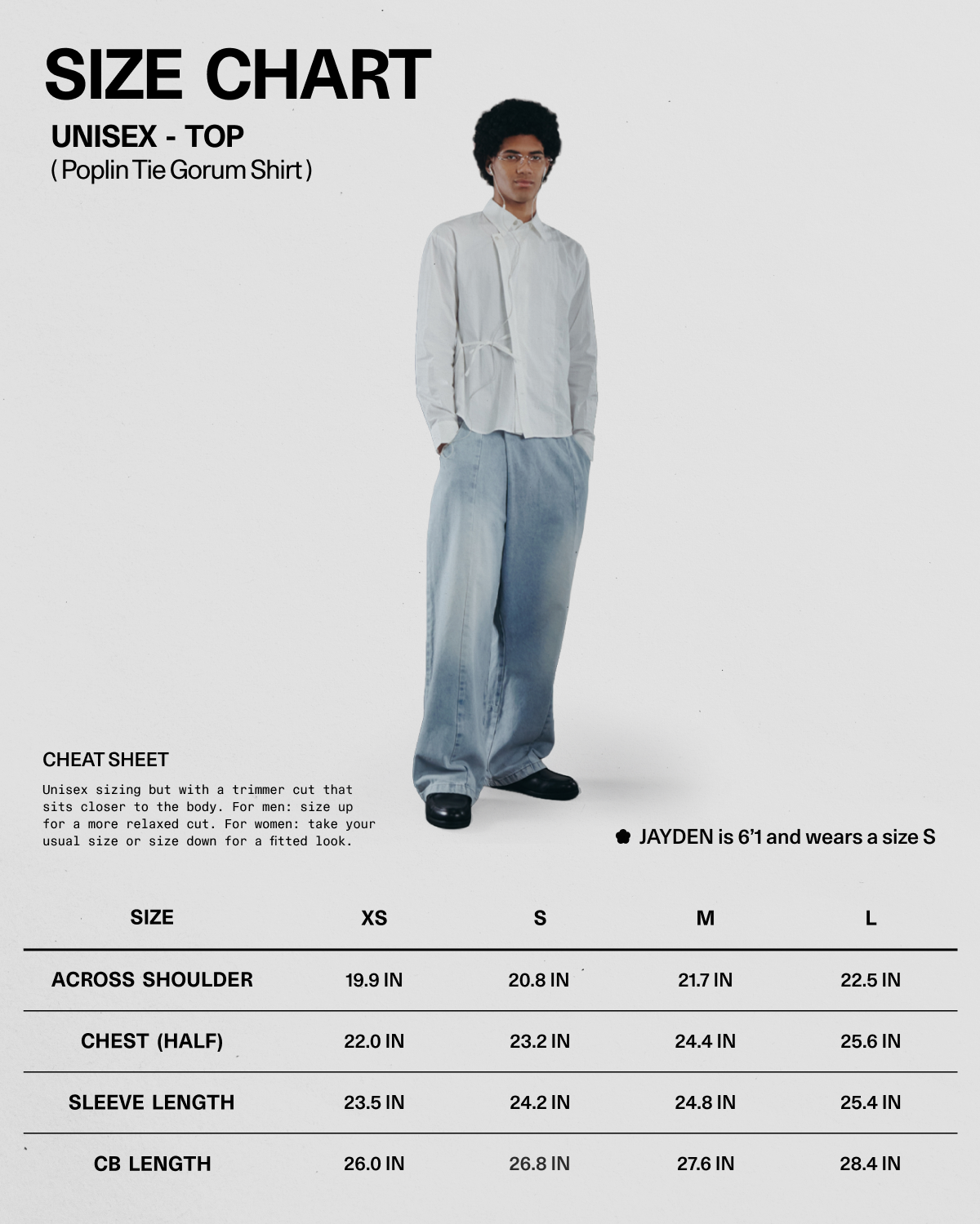 A person wearing the WHITE POPLIN TIE GORUM SHIRT by Sundae School and wide jeans stands beside a unisex size chart for the shirt, displaying XS–XL measurements. A note mentions that Jayden is 5'1" and wears a size S.