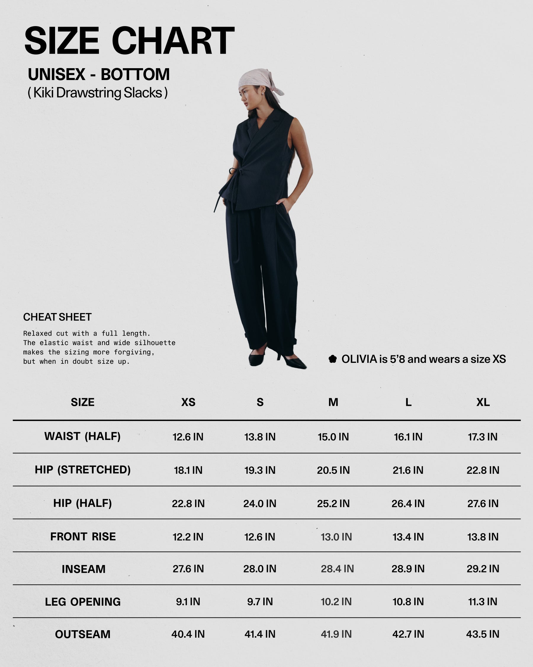 A woman in a black sleeveless top, KIKI DRAWSTRING SLACKS by Sundae School, and a white headscarf stands by a size chart (XS–XL) showing waist, hips, front rise, inseam, leg opening, outseam measurements and an elastic drawstring waist.