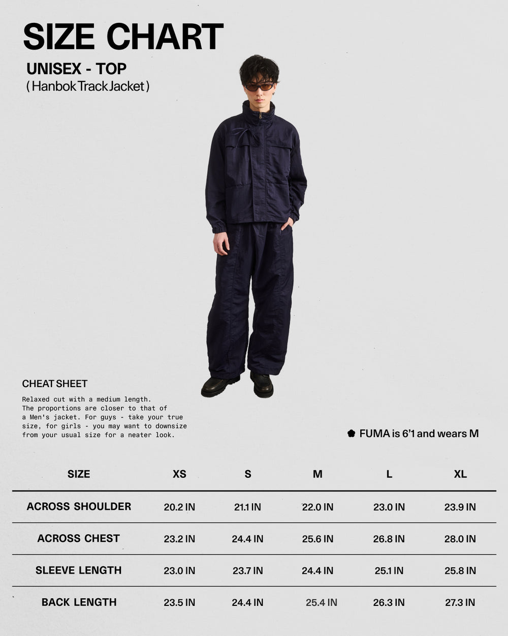 A person models the Sundae School NAVY HANBOK TRACK JACKET featuring a custom 떨 zipper pull, against a plain background. Below is a size chart (XS–L: shoulder, sleeve, back length). Model is 6'1", wearing size M.