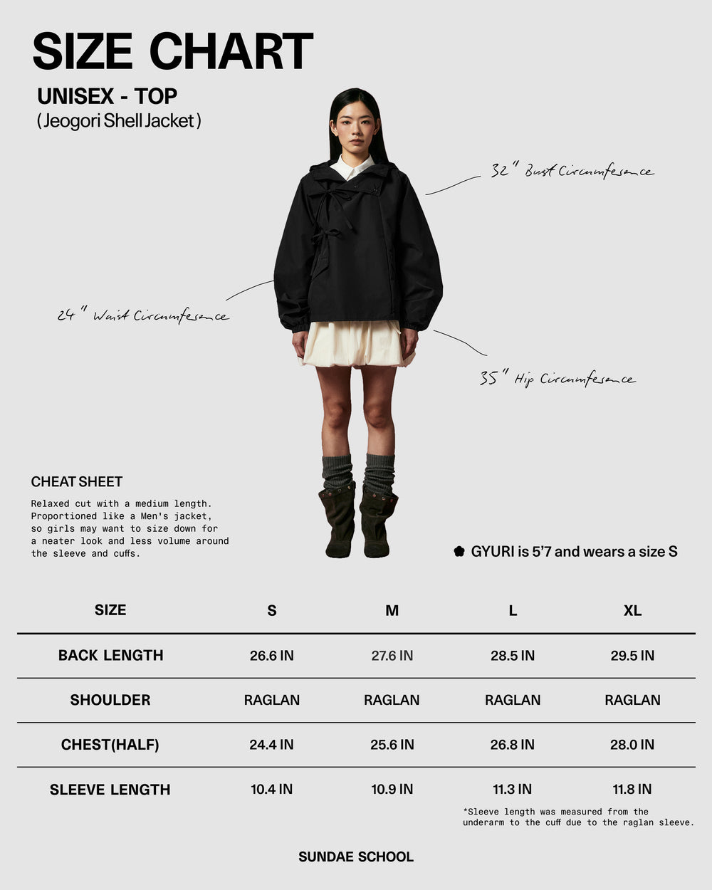 A female model wears the BLACK JEOGORI TIE SHELL JACKET by Sundae School, paired with a cream skirt, while standing in front of a size chart displaying unisex top measurements from S to XL. Handwritten measurement lines are marked on the model, highlighting this water-resistant outerwear as standout unisex technical apparel.