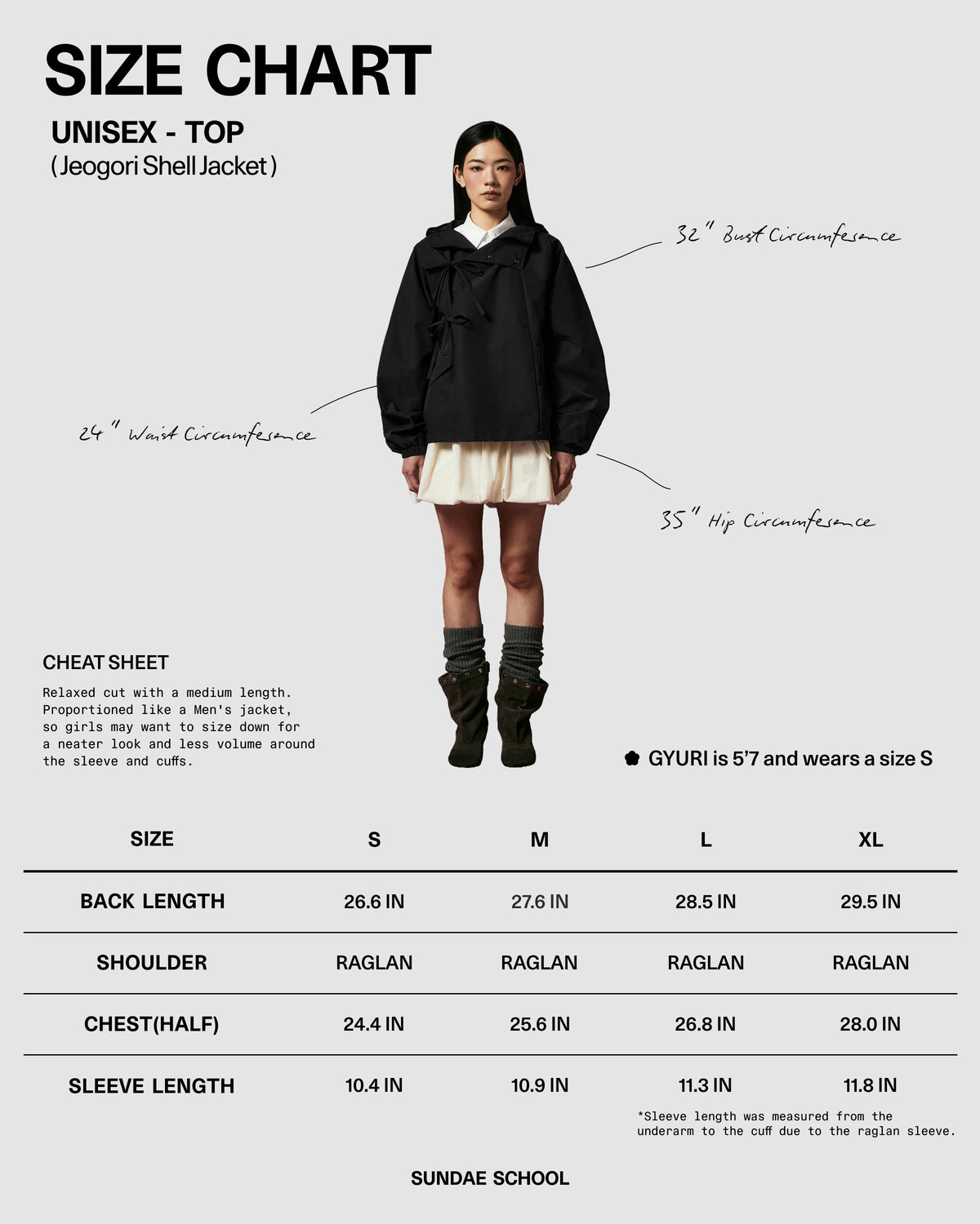 A female model wears the BLACK JEOGORI TIE SHELL JACKET by Sundae School, paired with a cream skirt, while standing in front of a size chart displaying unisex top measurements from S to XL. Handwritten measurement lines are marked on the model, highlighting this water-resistant outerwear as standout unisex technical apparel.