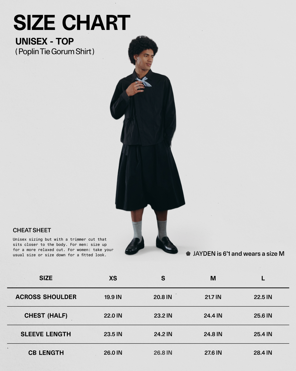 A 61-year-old male model is wearing a size M BLACK POPLIN TIE GORUM SHIRT by Sundae School in black, styled with a skirt. Below him is a size chart for unisex poplin shirts from XS to XL, showing measurements for across shoulder, chest, sleeve, and CB length.