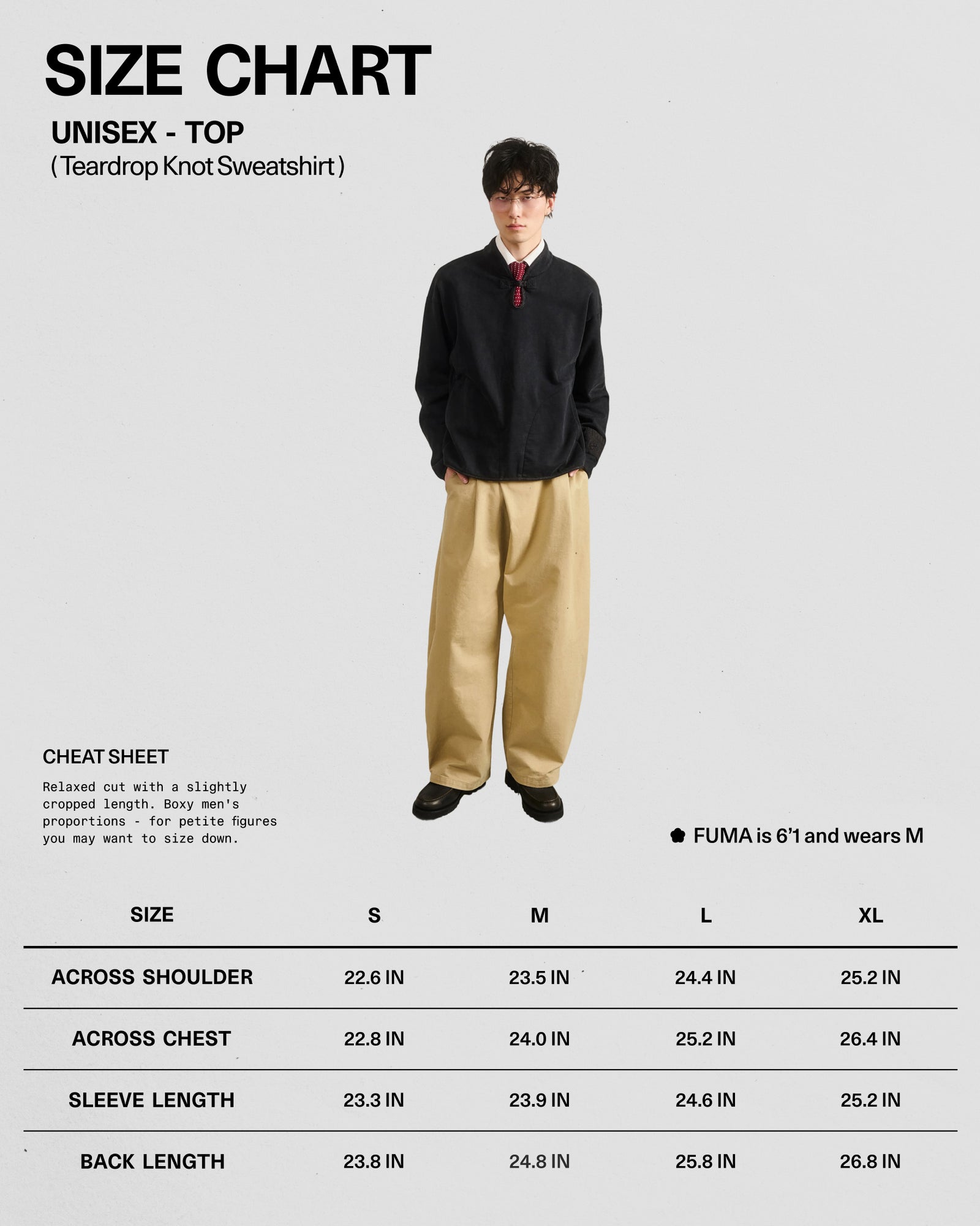 A person wearing the BLACK TEARDROP KNOT SWEATSHIRT by Sundae School, made from 100% cotton, along with beige pants, stands in front of a unisex sweatshirt size chart displaying measurements for sizes S, M, L, and XL.