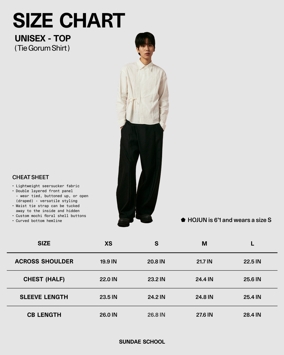 Size chart for a unisex top with a model wearing it, featuring measurements in inches.