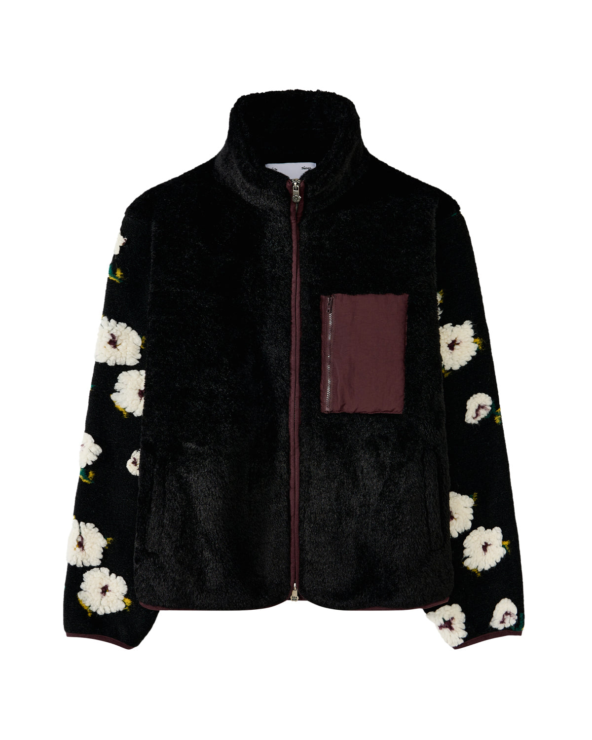 The MUGUNGHWA FLEECE by Sundae School is a black zip-up sherpa fleece jacket adorned with white floral motifs inspired by the Korean national flower on the sleeves, and features a maroon chest pocket on the left side.