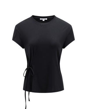 The BLACK ORIGAMI GORUM TEE by Sundae School is a women’s black short-sleeve t-shirt with a round neckline, an asymmetrical seam, and a side tie detail on the left waist, shown against a plain white background.