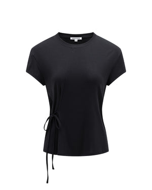 The BLACK ORIGAMI GORUM TEE by Sundae School is a women’s black short-sleeve t-shirt with a round neckline, an asymmetrical seam, and a side tie detail on the left waist, shown against a plain white background.