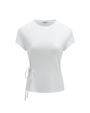The IVORY ORIGAMI GORUM TEE by Sundae School is a white, short-sleeve fitted t-shirt featuring a round neckline and a thin side tie detail on the left, displayed against a plain white background.