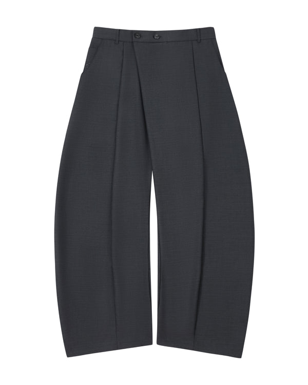 The CHARCOAL PLEATED HANBOK SLACKS by Sundae School are wide-leg, dark gray wool pants featuring deep pleats, a high waist with belt loops and two buttons, and side pockets. Reminiscent of the balloon silhouette found in hanbok pants, they are shown laid flat against a white background.