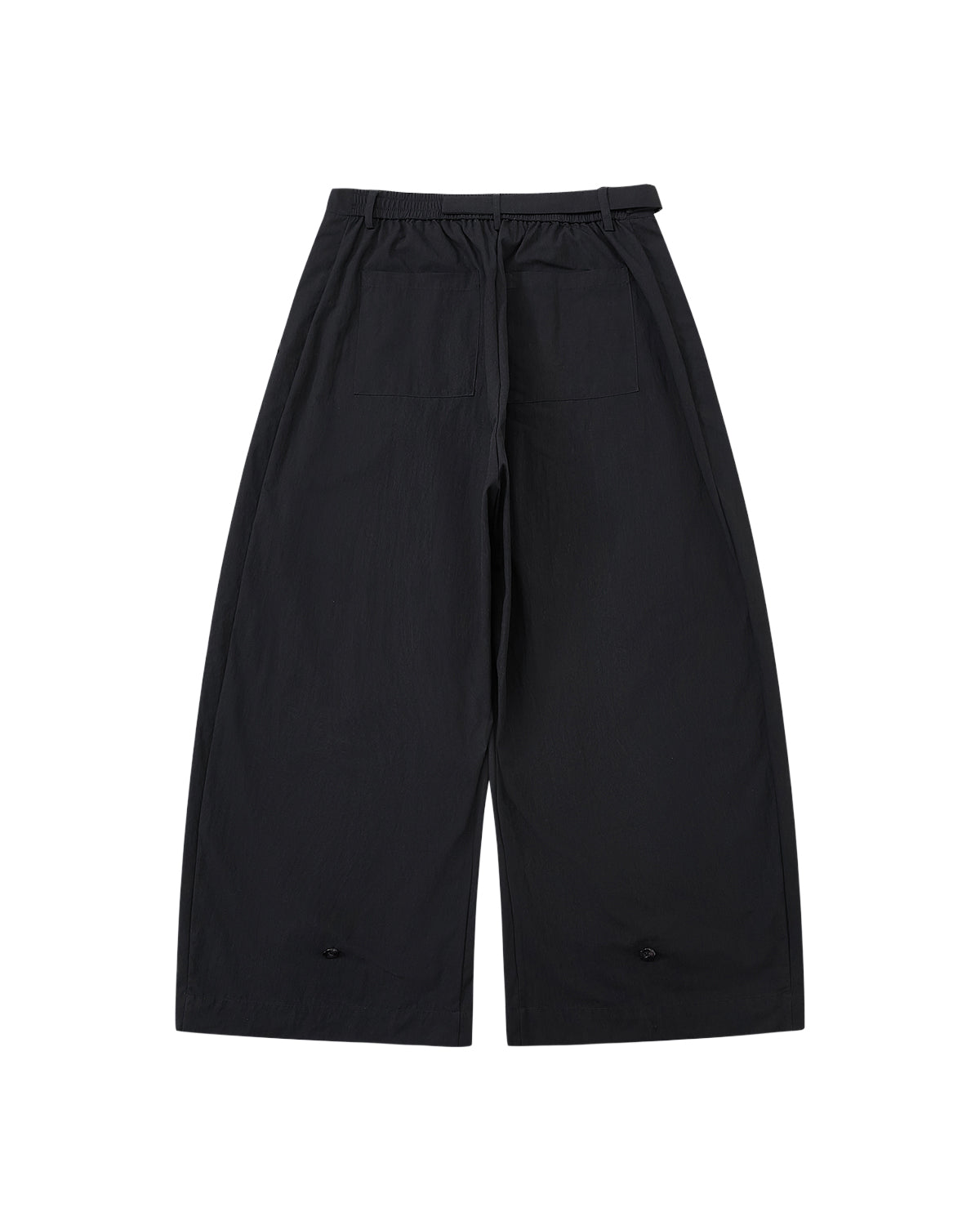 The BLACK PLEATED PALAZZO PANTS from Sundae School are shown laid flat on a light gray background, featuring an elastic waistband, belt loops, two large back pockets, and mochi button details near each pant leg's hem.