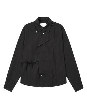 Introducing the BLACK POPLIN TIE GORUM SHIRT by Sundae School: a black long-sleeve, unisex tailored-fit shirt crafted from crisp cotton-nylon poplin. Featuring a unique asymmetric front with snap buttons and side tie detail, this modern yet timeless piece is laid flat against a white background, blending contemporary design with lasting comfort.