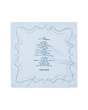 A sheer sky blue organza bandana from Sundae School features decorative dots along the edge and showcases printed text in a sundae-shaped arrangement at the center, including “THE TEN COMMANDMENTS” and “SUNDAE SCHOOL TEN COMMANDMENTS,” among other phrases.