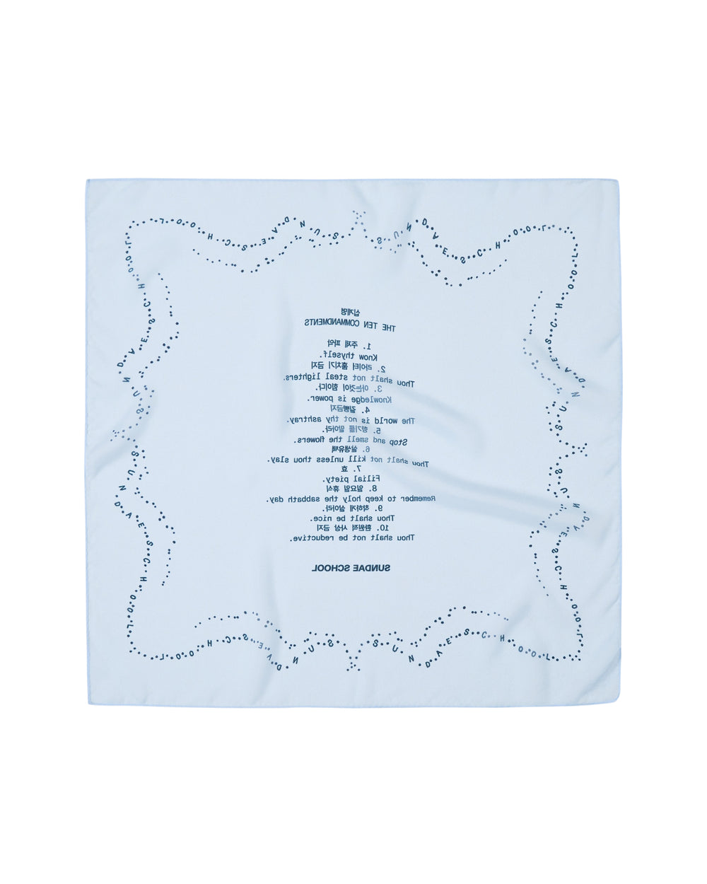 A SKY BLUE 10 COMMANDMENTS ORGANZA BANDANA by Sundae School, featuring a light blue sheer organza fabric with a dotted border and reversed blue text printed at the center, displayed on a white background.