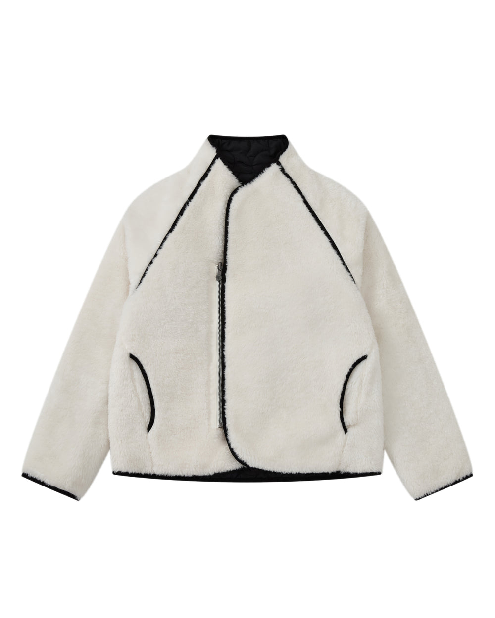 The BLACK IVORY REVERSIBLE FLOWER QUILTED JEOGORI FLEECE by Sundae School—a modern reinterpretation of a classic hanbok-style coat—features plush white faux fur with contrasting black trim, an asymmetrical zipper, and two side pockets, artfully displayed flat against a white background.