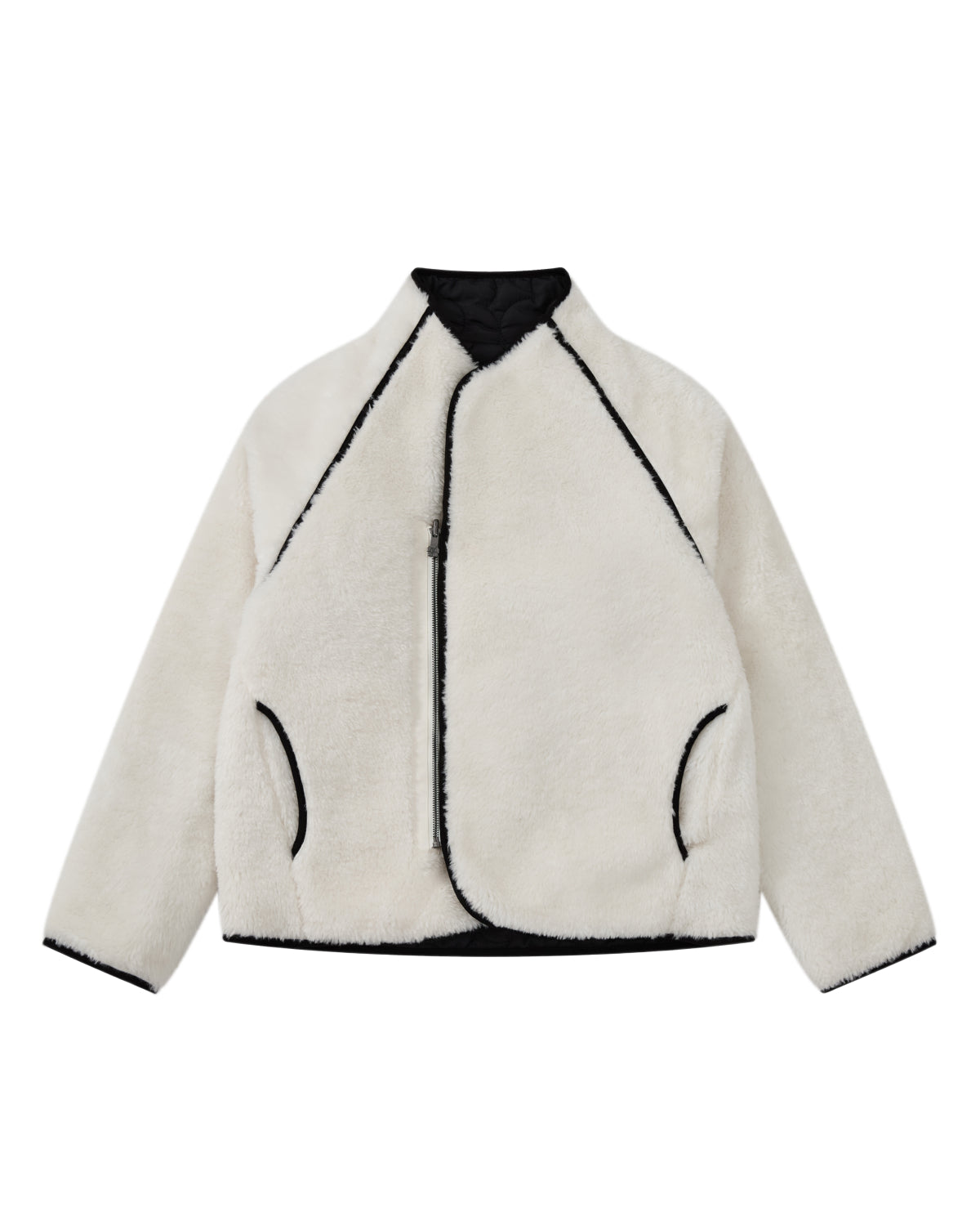 The BLACK IVORY REVERSIBLE FLOWER QUILTED JEOGORI FLEECE by Sundae School—a modern reinterpretation of a classic hanbok-style coat—features plush white faux fur with contrasting black trim, an asymmetrical zipper, and two side pockets, artfully displayed flat against a white background.