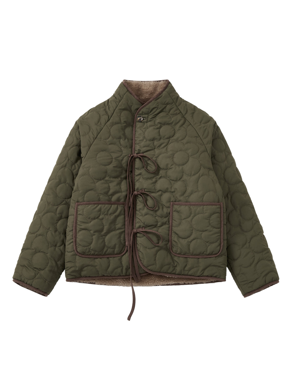 Discover the Sundae School KHAKI REVERSIBLE FLOWER QUILTED JEOGORI FLEECE—a hanbok-inspired jacket featuring flower-pattern quilting, two spacious front pockets, brown trim accents, and tie closures. The unique silhouette is highlighted by its high collar and long sleeves. Inside, a plush beige fleece lining delivers the cozy comfort of a faux-sherpa puffer, blending style and warmth for cooler weather.