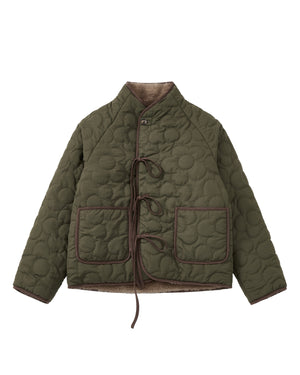Discover the Sundae School KHAKI REVERSIBLE FLOWER QUILTED JEOGORI FLEECE—a hanbok-inspired jacket featuring flower-pattern quilting, two spacious front pockets, brown trim accents, and tie closures. The unique silhouette is highlighted by its high collar and long sleeves. Inside, a plush beige fleece lining delivers the cozy comfort of a faux-sherpa puffer, blending style and warmth for cooler weather.