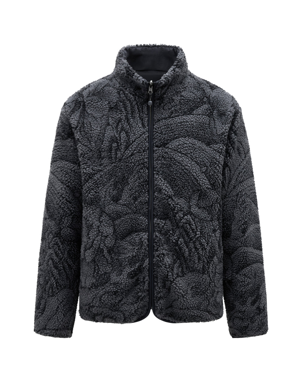 The BLACK REVERSIBLE IREZUMI FLEECE by Sundae School is a dark gray jacquard fleece jacket featuring a high collar, full front zipper, and textured pattern. It has long sleeves, a cozy plush appearance, and is accented with subtle tiger and dragon graphics for added style.