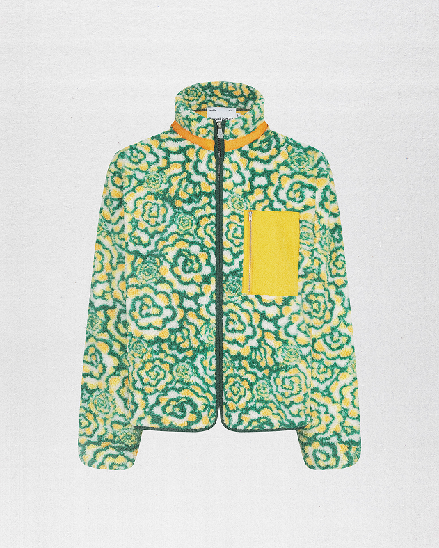 a male model wearing Sundae School Broccoli Fleece against a brown background.