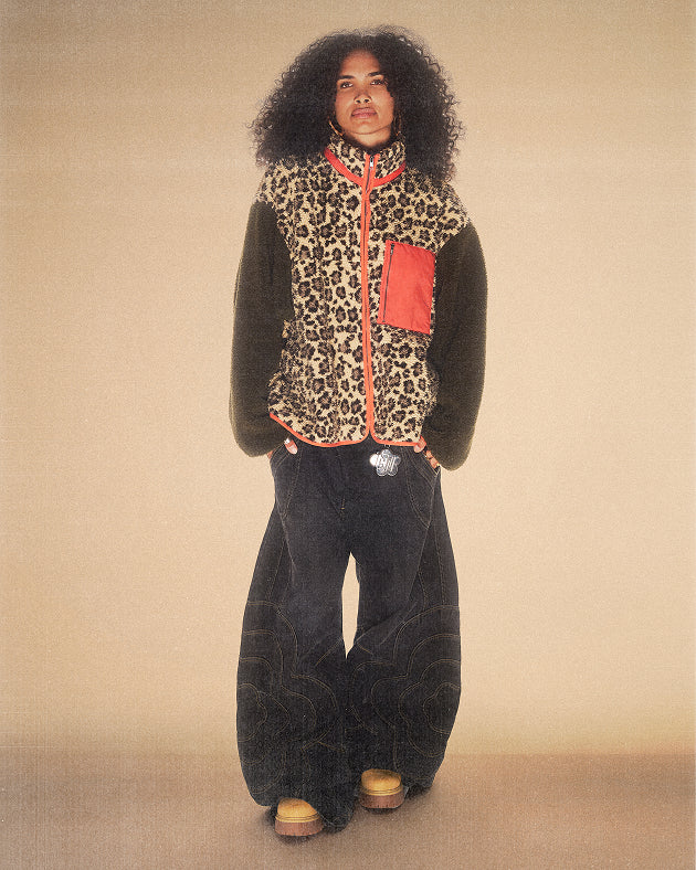 A female model wearing Sundae School Tiger Mom Fleece on a brown background.