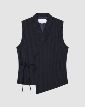 The SABRINA VEST by Sundae School is a sleeveless black pinstripe wool vest with an asymmetrical front, notch collar, single chest pocket, and side Korean goreum tie. The interior label reads SÉFR SHADE SCHOOL and it's shown laid flat on a light gray background.