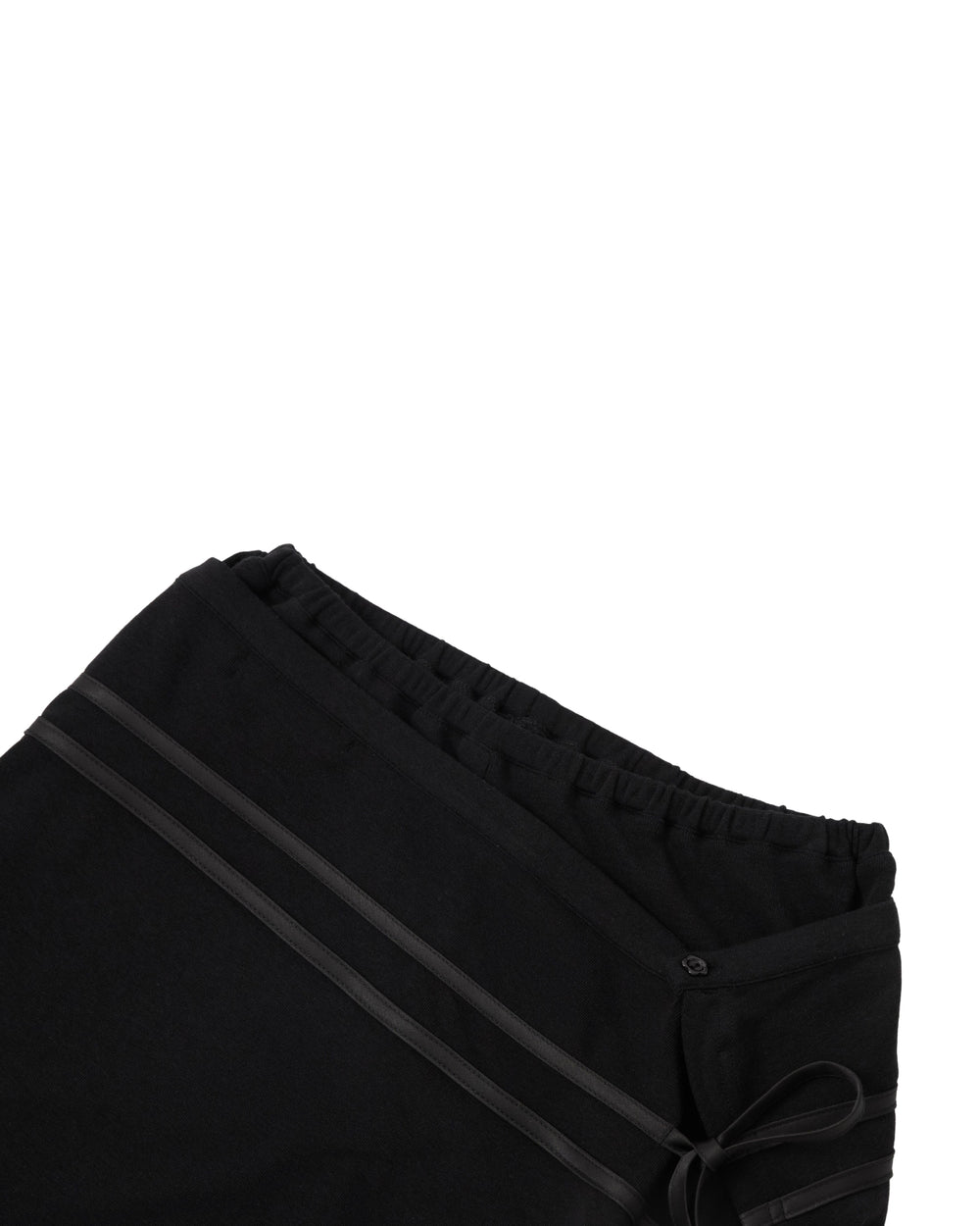 Black Seongsu Apron Pants featuring an elastic waistband and a side tie closure with layered trim.
