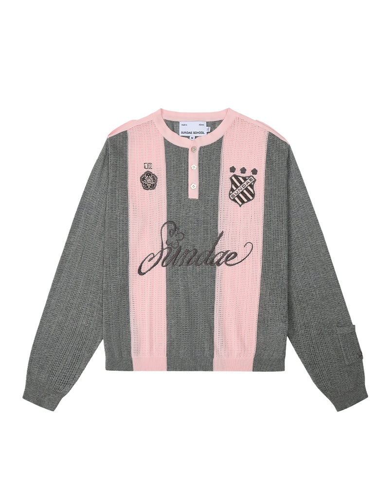 Introducing the PINK SUNDAE SOCCER JERSEY by Sundae School: This long-sleeve knit shirt features vertical pink and gray stripes, a classic collar with three buttons, and custom embroidered chest patches—including “Sundae” in script and two crest-style emblems. Made from 100% lightweight cotton with perforated knit detailing for breathability.