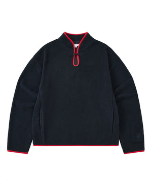 A cozy navy fleece pullover named the NAVY TEARDROP KNOT FLEECE by Sundae School, featuring a short zipper, red trim on the collar, cuffs, and hem, and long sleeves. This East Asian inspired garment is displayed laid flat on a white background.