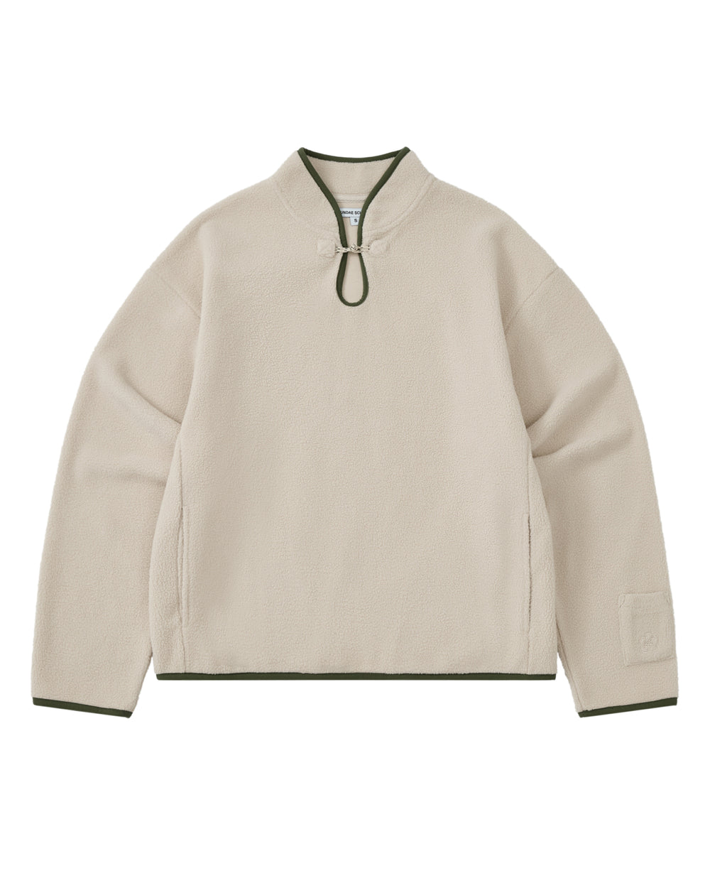 Introducing the TAUPE TEARDROP KNOT FLEECE from Sundae School: this cozy fleece pullover features long sleeves and a rounded collar with a front loop closure. Dark green trim accents the collar, cuffs, and hem, while its minimalistic design is elevated by subtle East Asian-inspired details for a timeless aesthetic.