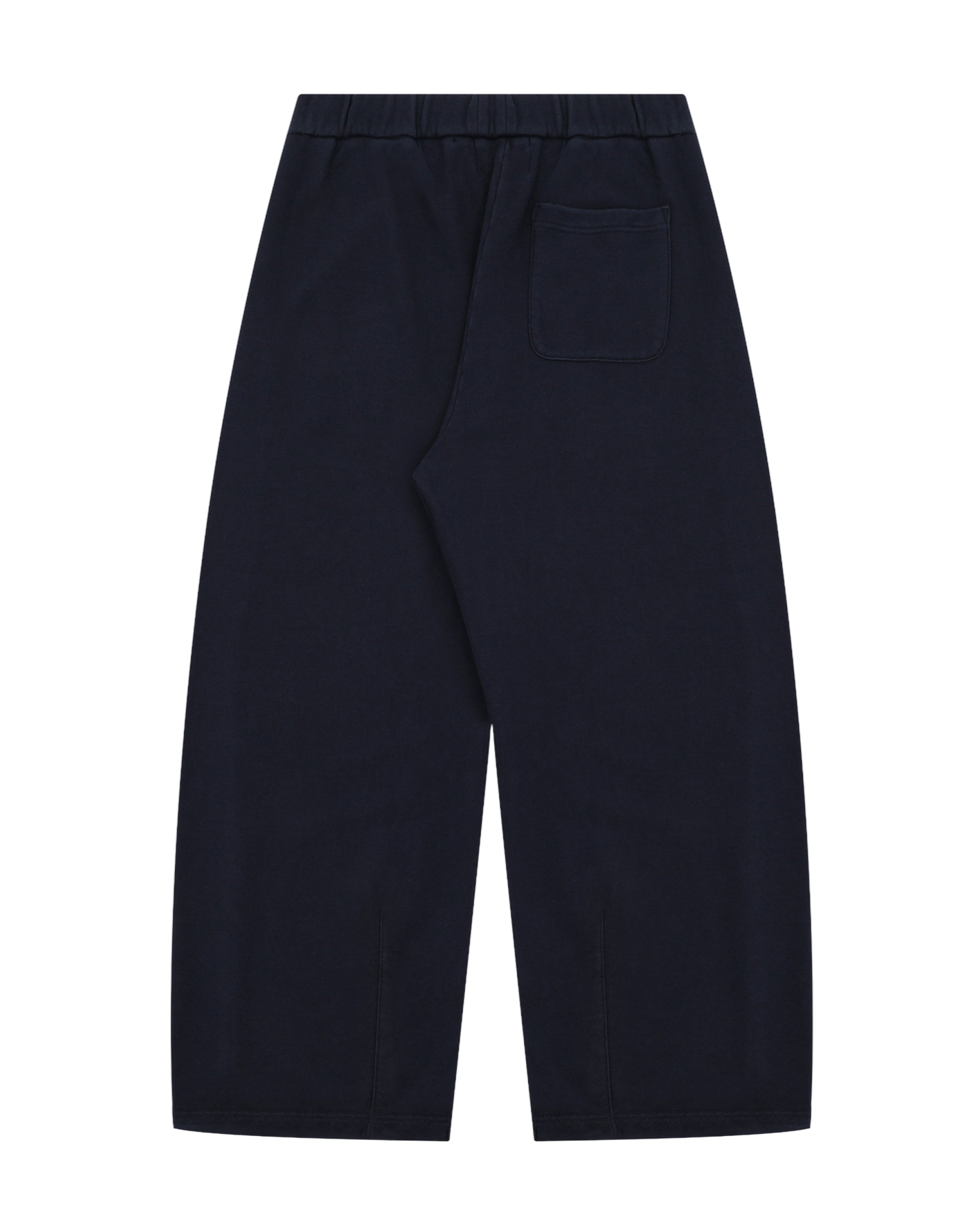 A pair of Sundae School NAVY WASH WRAP SWEAT BAJI, loose-fitting cotton sweatpants in dark navy blue with a single back pocket, displayed flat on a white background.