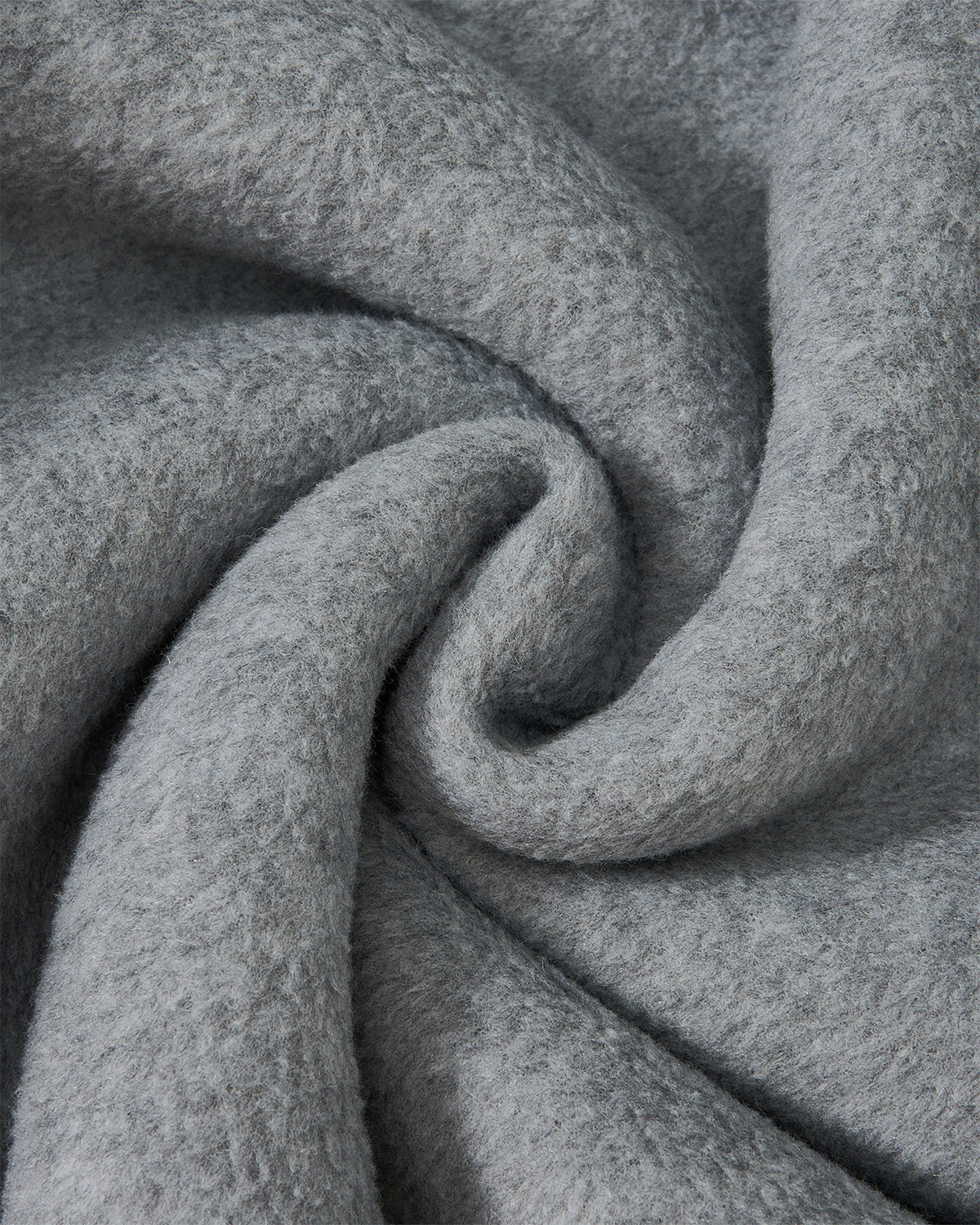 Close-up of Sundae School's IVORY MUGUNGHWA FLEECE, showcasing its soft, light gray jacquard texture arranged in a gentle spiral fold.