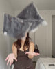 An unboxing and try-on video of a dark navy, Korean-inspired streetwear track set from Sundae School. A woman puts on relaxed wide-leg track pants with zipped ankle details and pairs them with a matching zip-up track jacket. She highlights design features including an embroidered floral emblem on a sleeve stash pocket and a traditional tie-front detail at the high-neck collar.