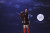 A video of a female model wearing Sundae School Five Peaks Fleece jumping into the night sky